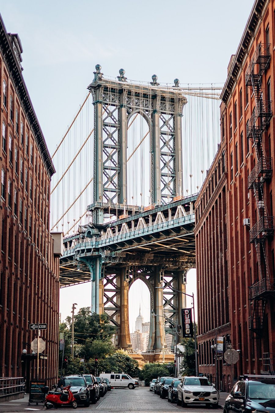 DUMBO, Brooklyn — Manhattan Bridge framed between warehouse buildings on Washington Street